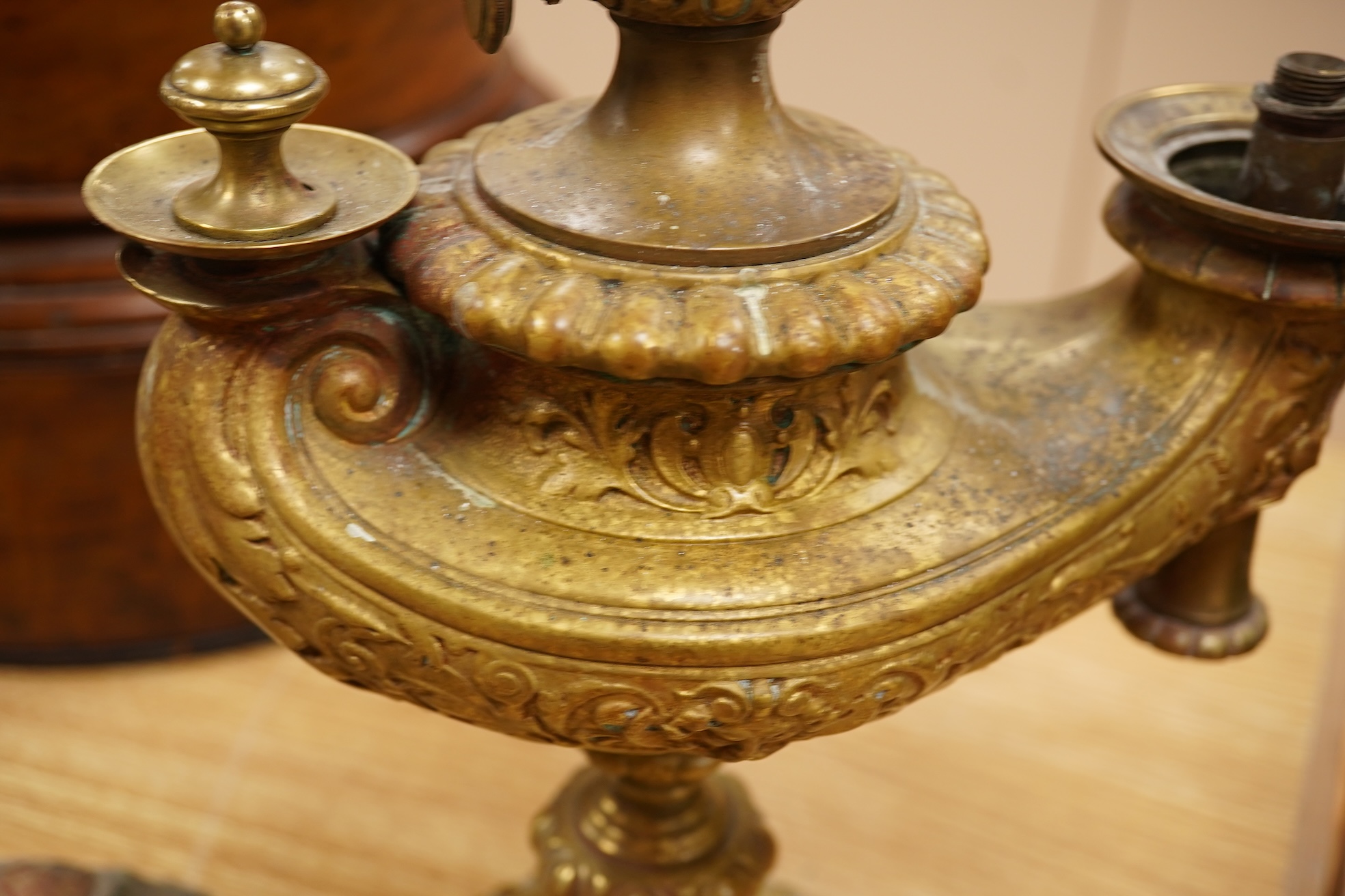 A brass ‘oil lamp’ lamp base and a polychrome painted wood pillar, 75cm